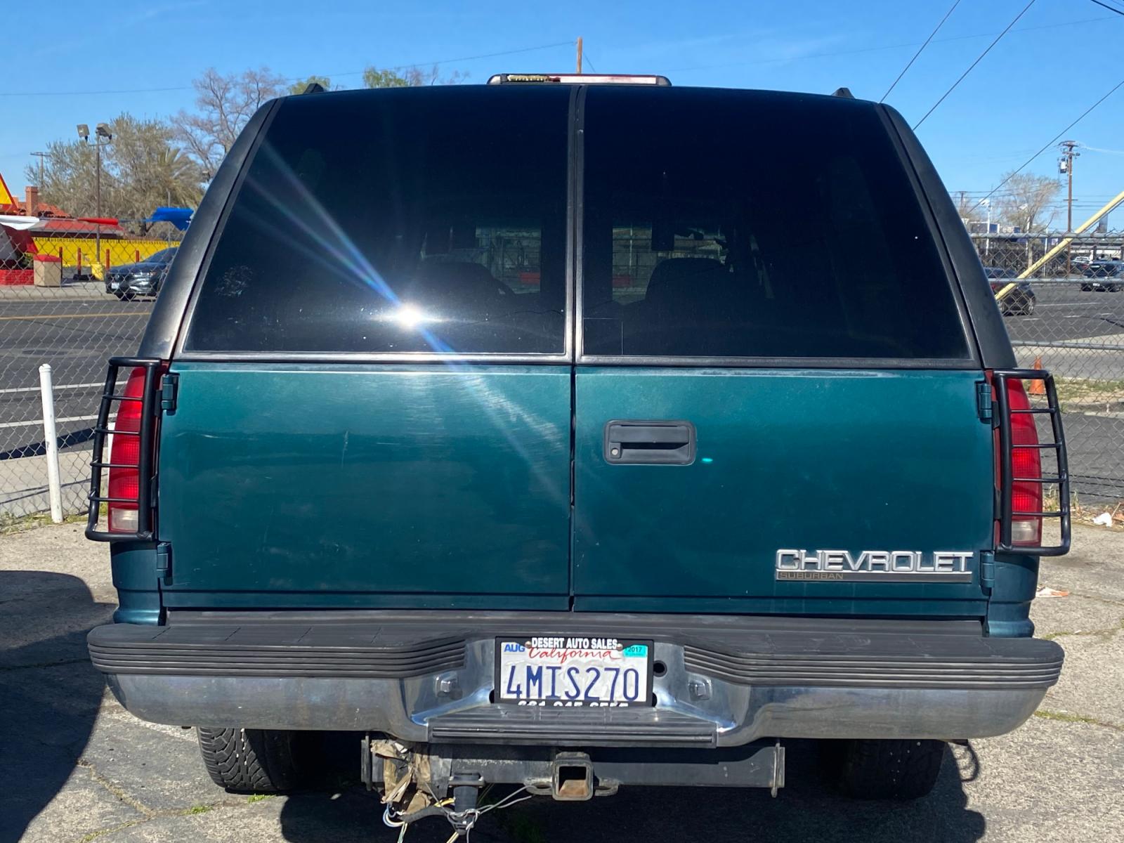 1996 Chevrolet Suburban C1500 2WD (1GNEC16R4TJ) with an 5.7L V8 OHV 16V engine, 4-Speed Automatic Overdrive transmission, located at 44356 Date Ave., Lancaster, CA, 93534, (661) 945-6555, 34.688919, -118.139374 - Photo #1